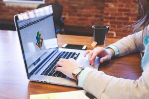 Canva - Woman Using Macbook